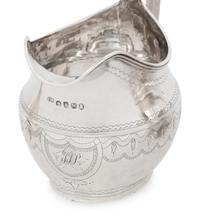 A Group of Four English Silver Creamers