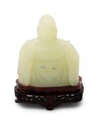 A Chinese Serpentine Figure of a Laughing Buddha