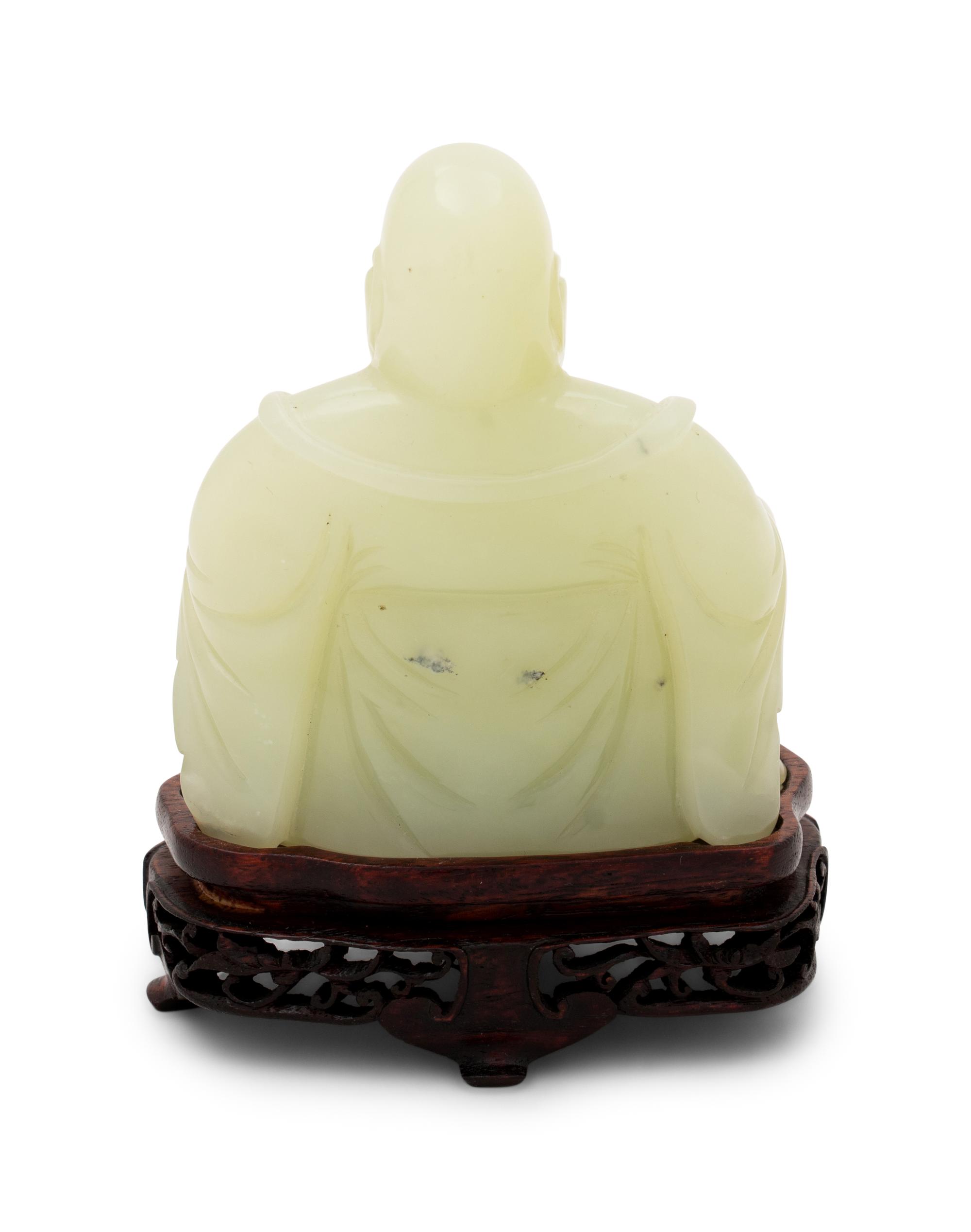A Chinese Serpentine Figure of a Laughing Buddha