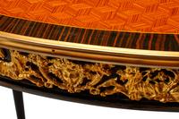 A Pair of Louis XV Style Parquetry and Gilt Bronze Mounted Tables