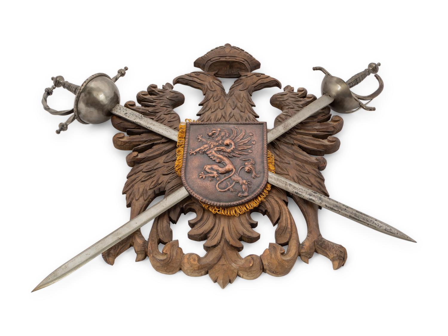 A Continental Carved Armor Trophy with Crossed Swords