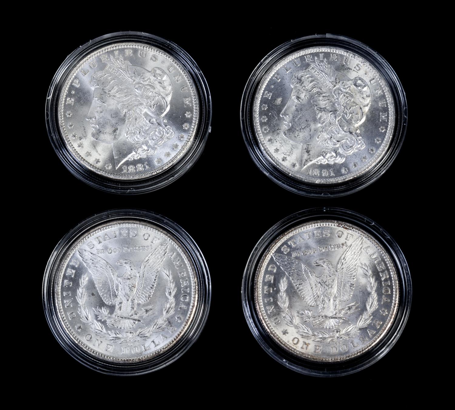 A Collection of Four United States Morgan Silver Dollars