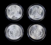 A Collection of Four United States Morgan Silver Dollars