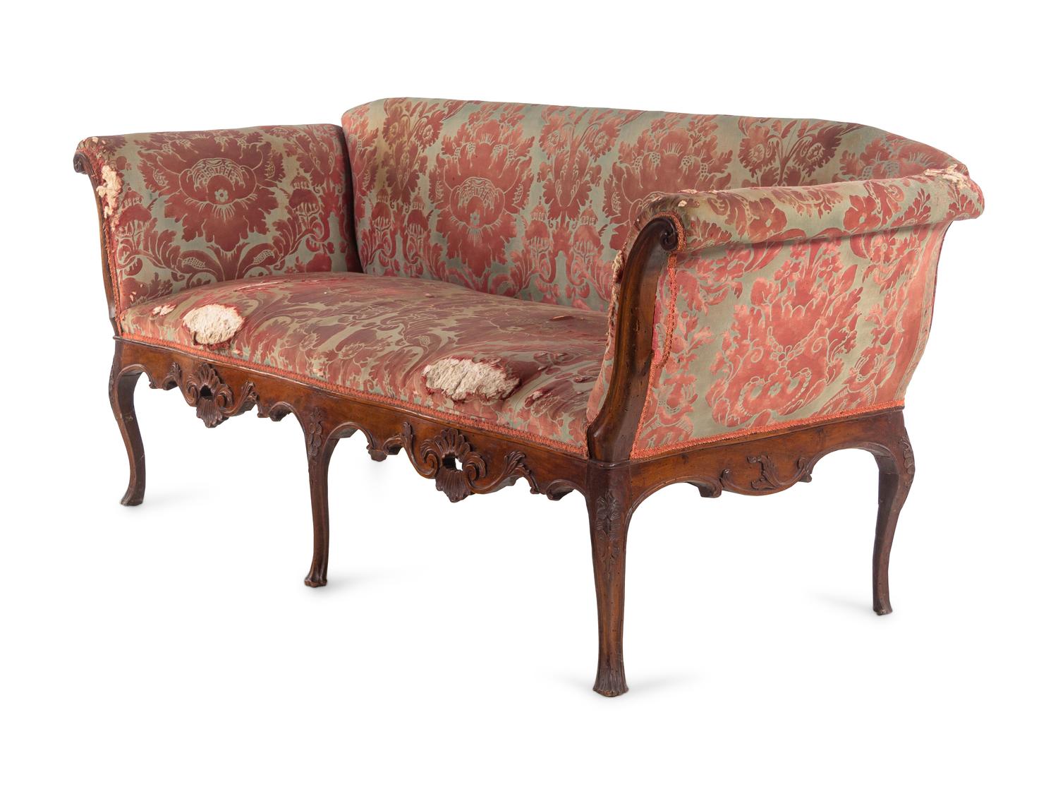 An Italian Carved Walnut Sofa