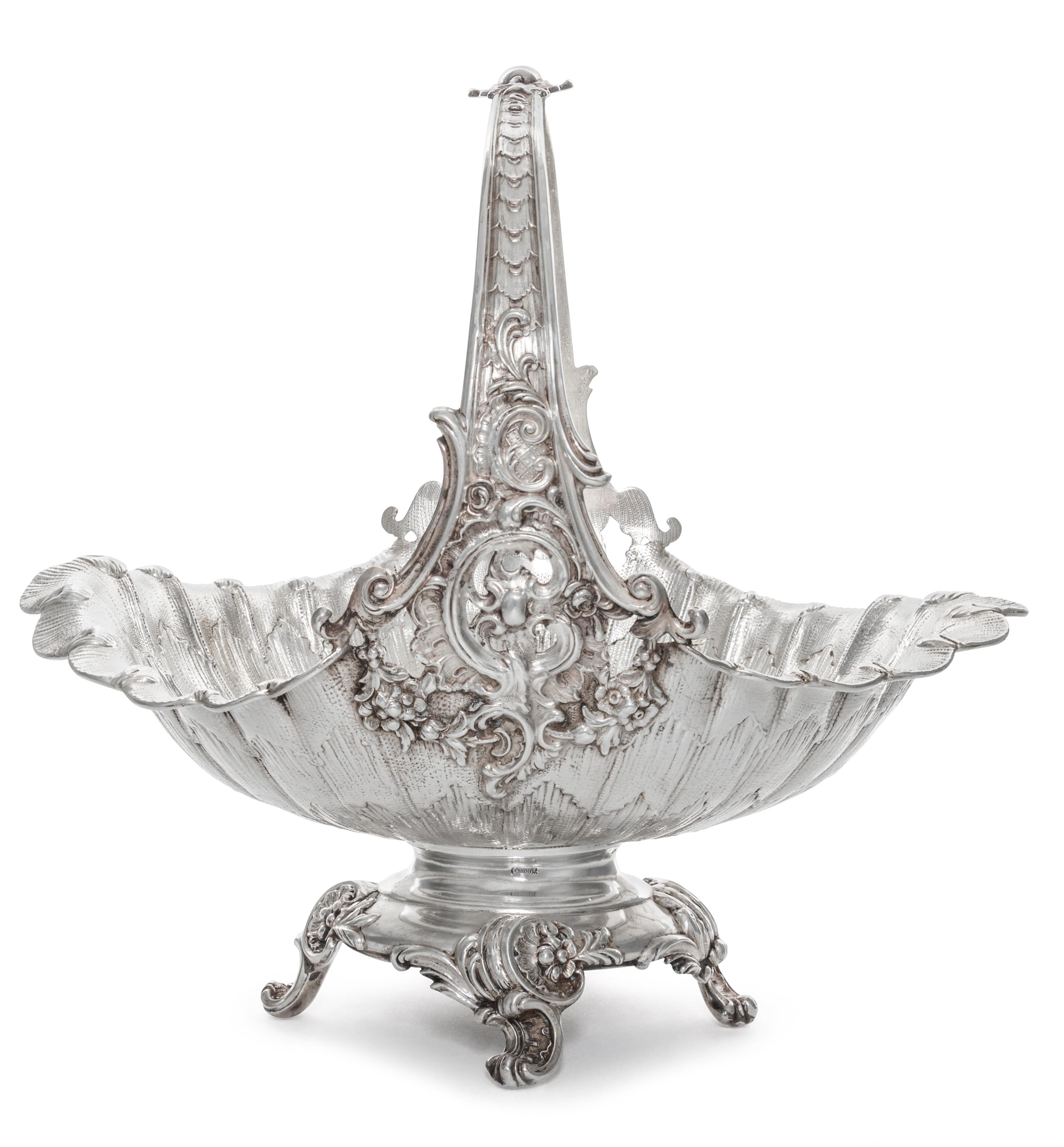A German Silver Basket, Early 20th Cenury, of oval, handled form with scrolling foliate decoration.