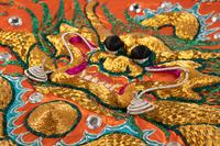 Two Chinese Orange Ground Embroidered Silk Theatrical Robes and A Cape