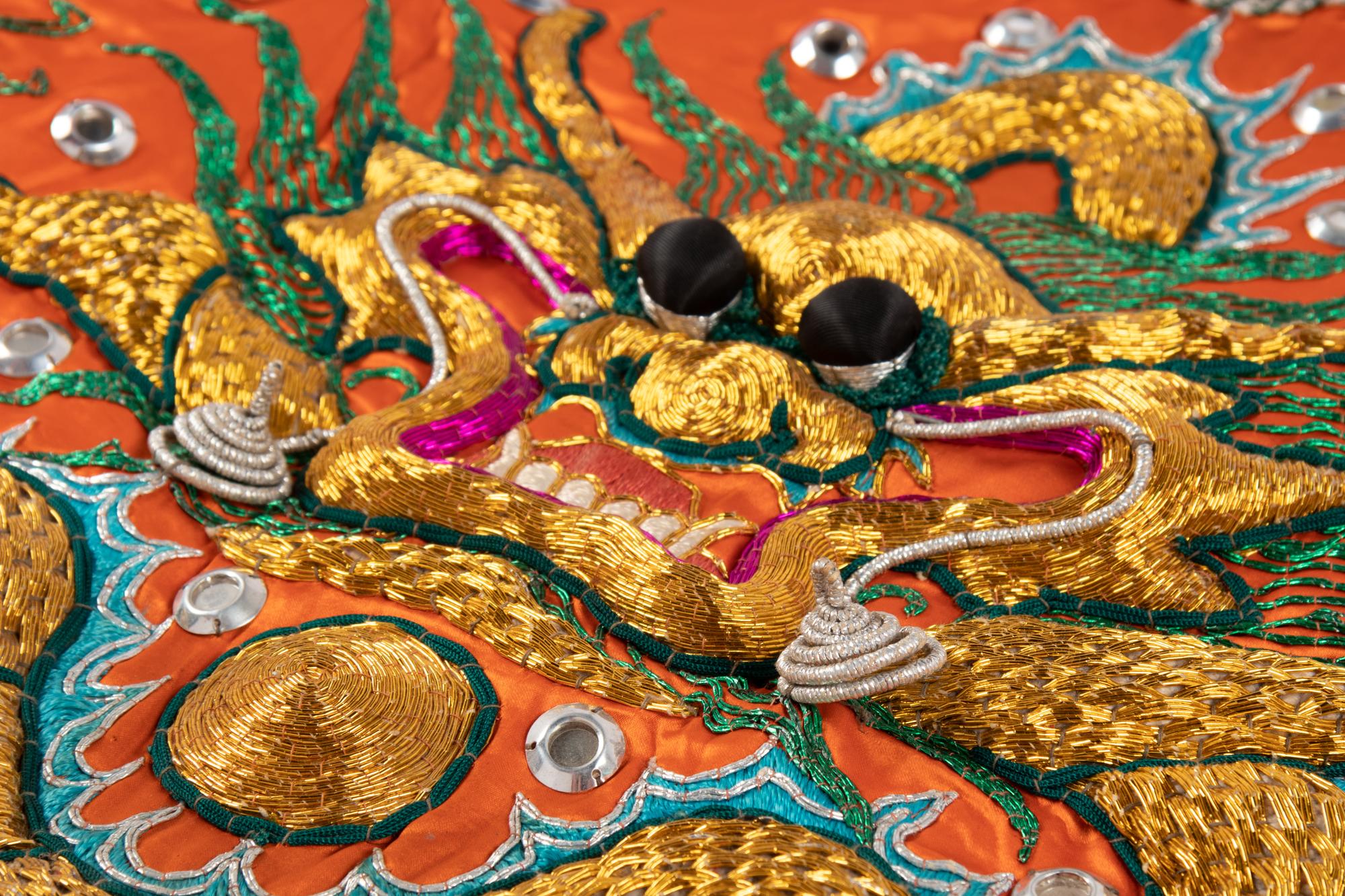 Two Chinese Orange Ground Embroidered Silk Theatrical Robes and A Cape