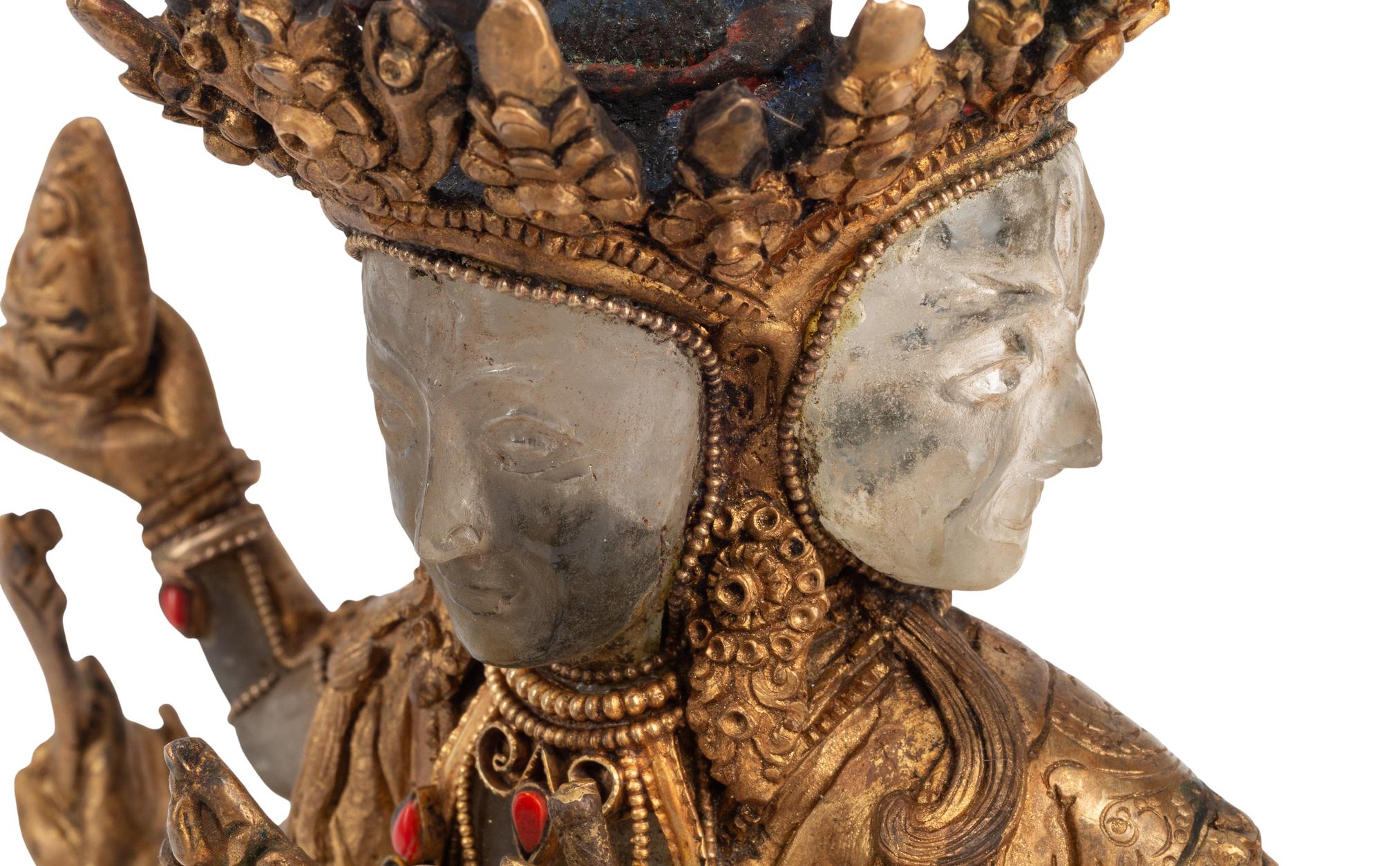 A Tibetan Style Gilt Bronze, Rock Crystal and Cabochon-Inset Figure of a Deity