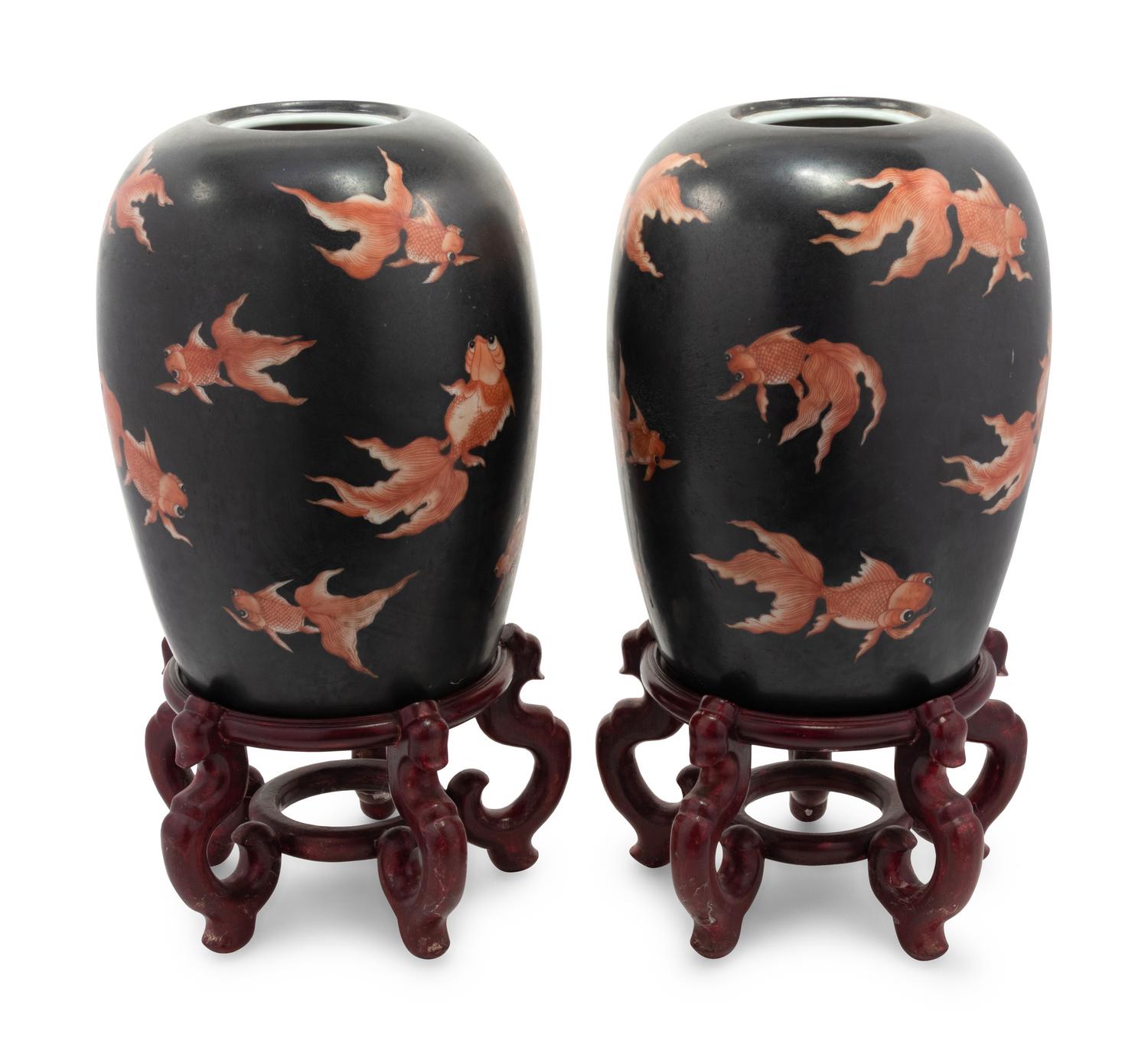 A Pair of Chinese Porcelain Goldfish Jars with Wood Stands