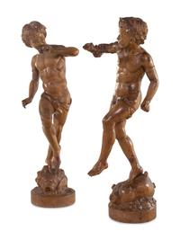 A Pair of Continental Carved Wood Figures of Dancing Putti