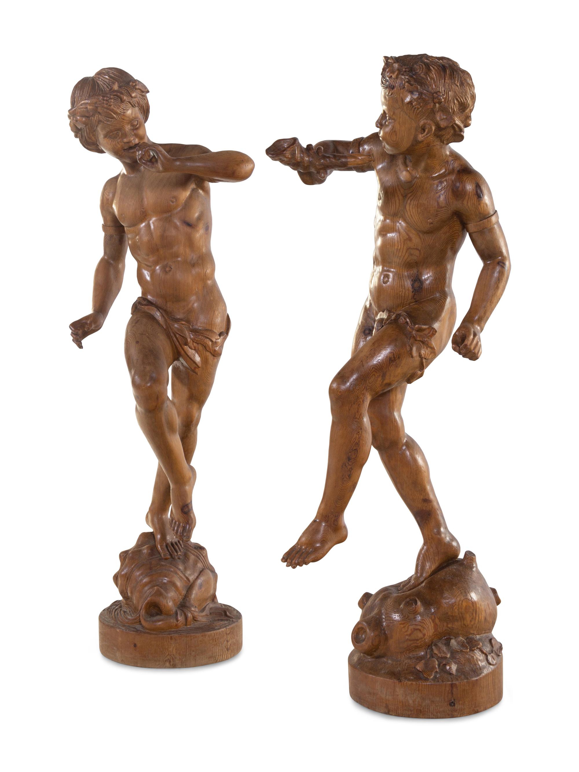 A Pair of Continental Carved Wood Figures of Dancing Putti