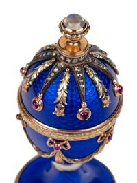 A 14 Karat Vari-Color Gold, Guilloché Enamel, Diamond, and Cabochon Jewel-Mounted Egg-Form Perfume and a Related Guilloché Enamel, 14 Karat Vari-Color Gold, Diamond, and Cabochon-Mounted Surprise Egg