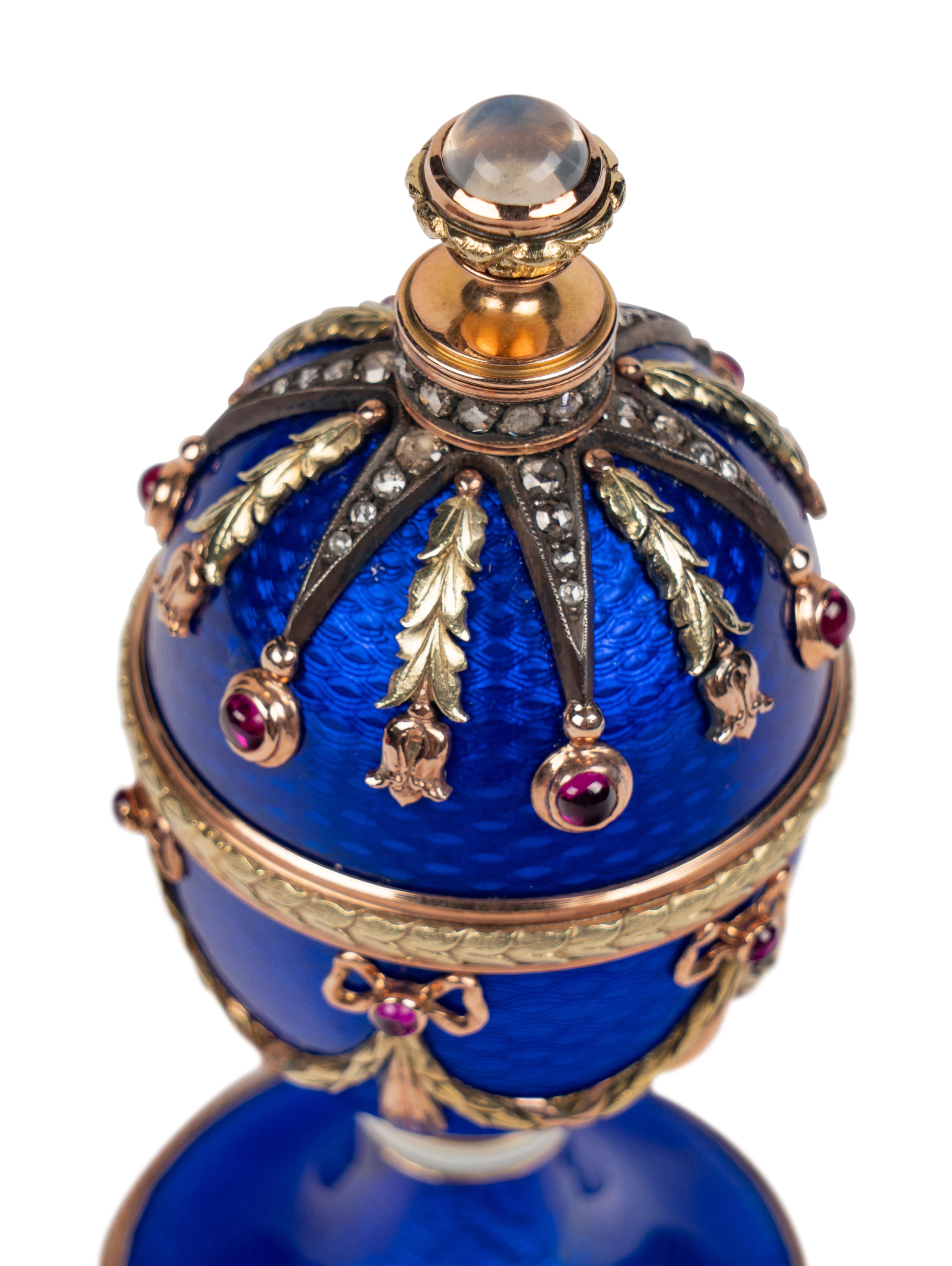 A 14 Karat Vari-Color Gold, Guilloché Enamel, Diamond, and Cabochon Jewel-Mounted Egg-Form Perfume and a Related Guilloché Enamel, 14 Karat Vari-Color Gold, Diamond, and Cabochon-Mounted Surprise Egg
