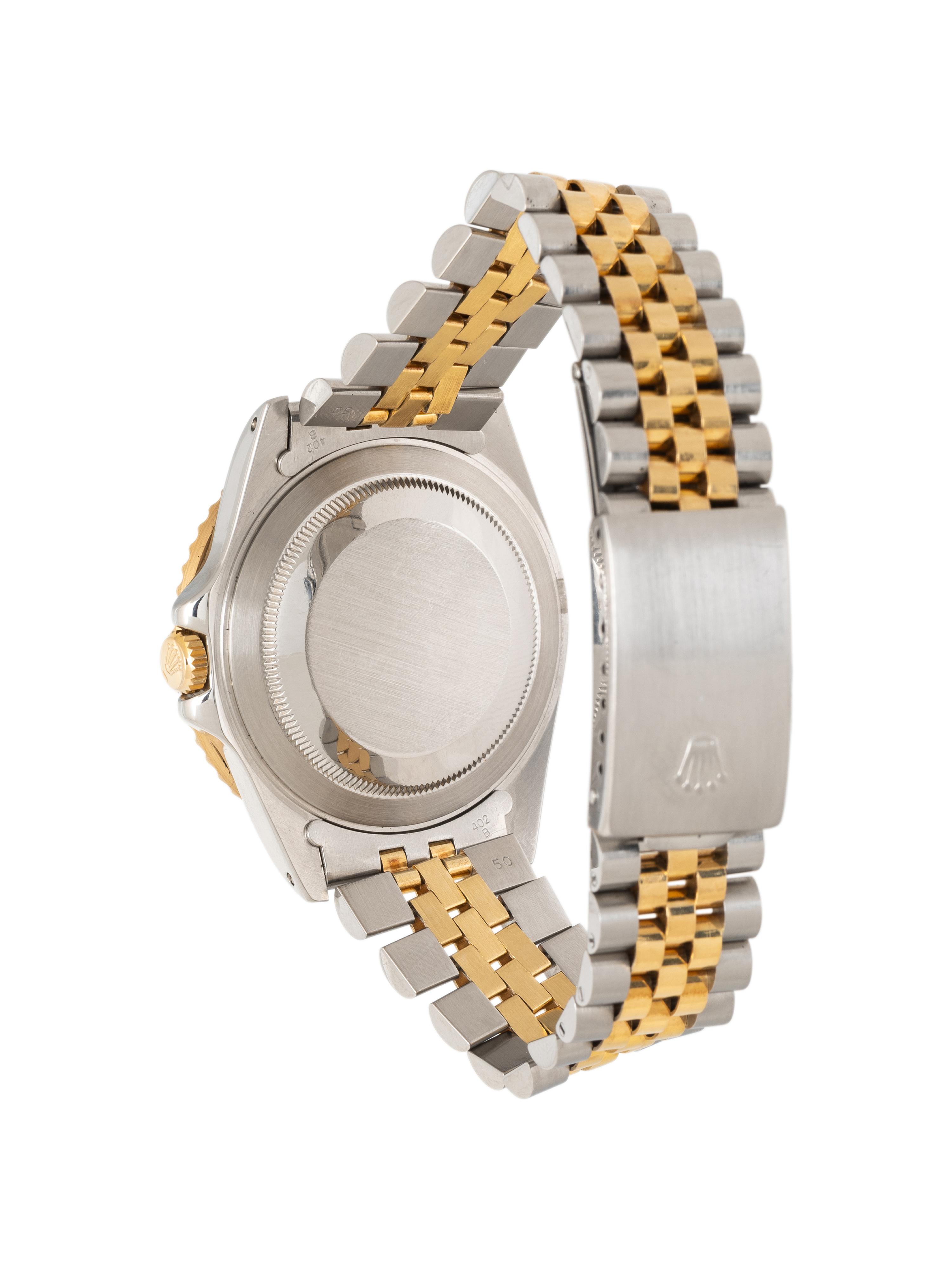 ROLEX, REF. 16713 STAINLESS STEEL AND 18K YELLOW GOLD 'GMT-MASTER II' 'ROOT BEER' WATCH, BOX & PAPERS