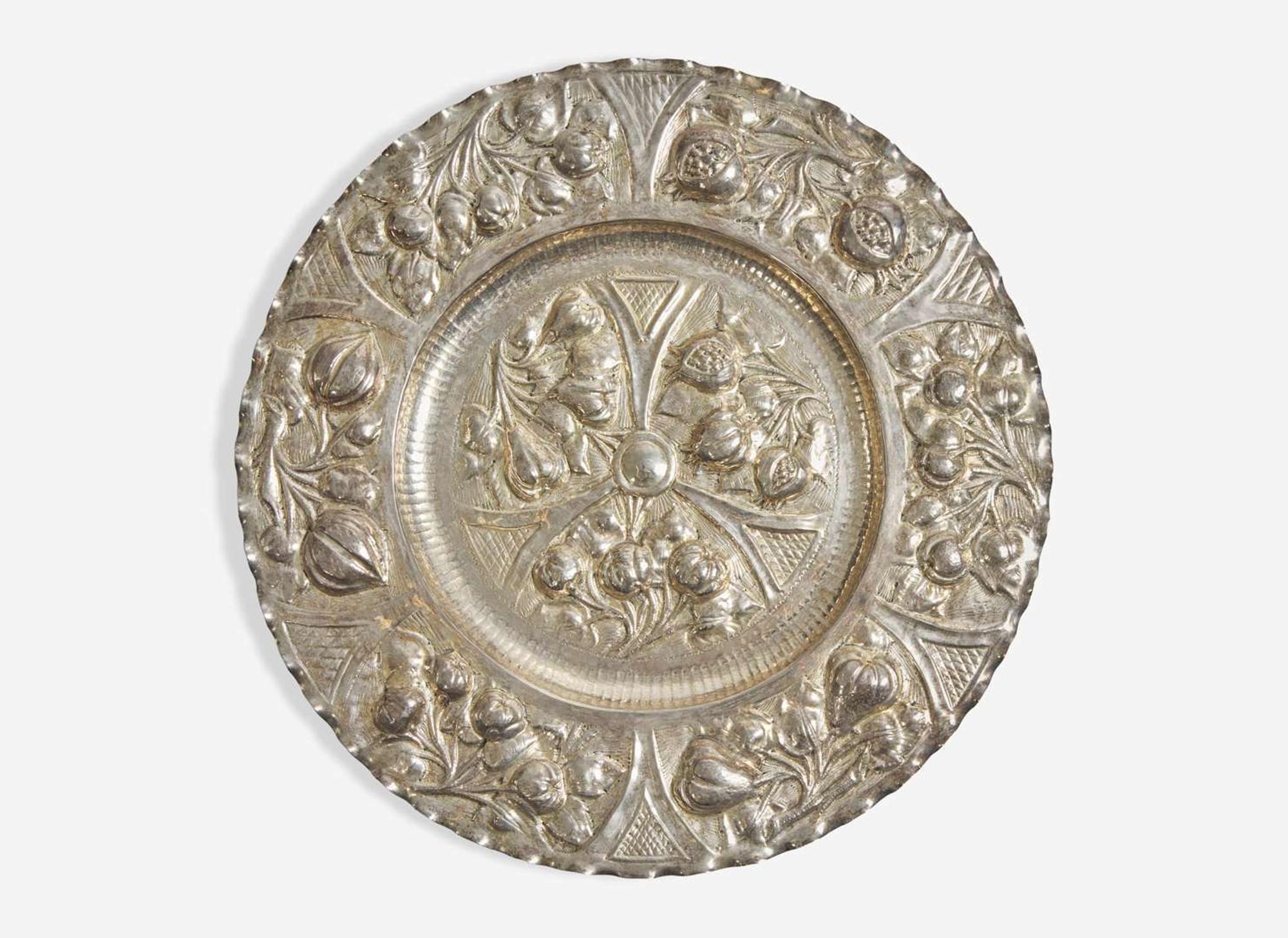 A Portuguese silver repoussé charger, 19th / 20th century