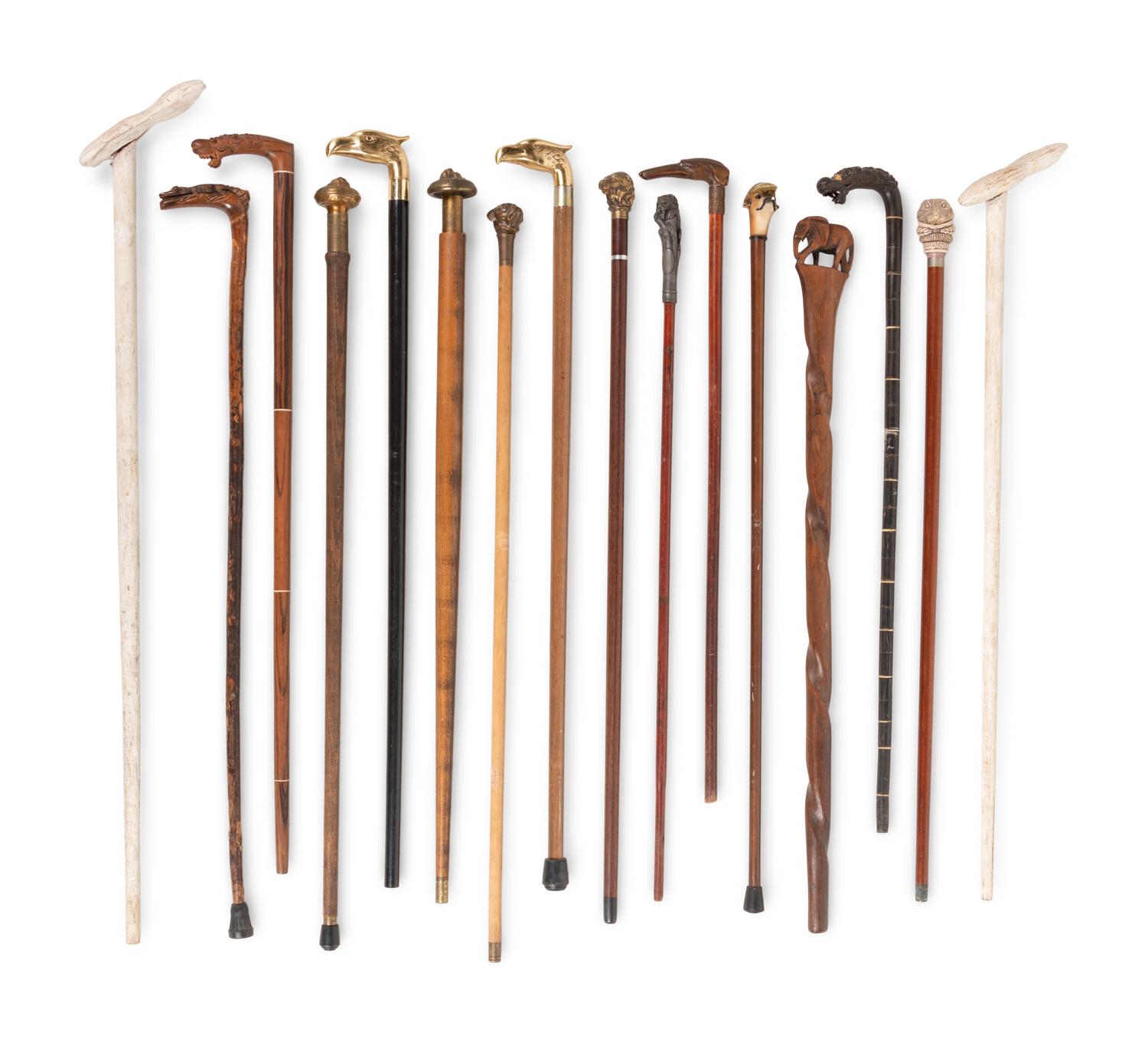 A Collection of Sixteen Carved and Mixed Metal Decorated Zoomorphic Walking Sticks