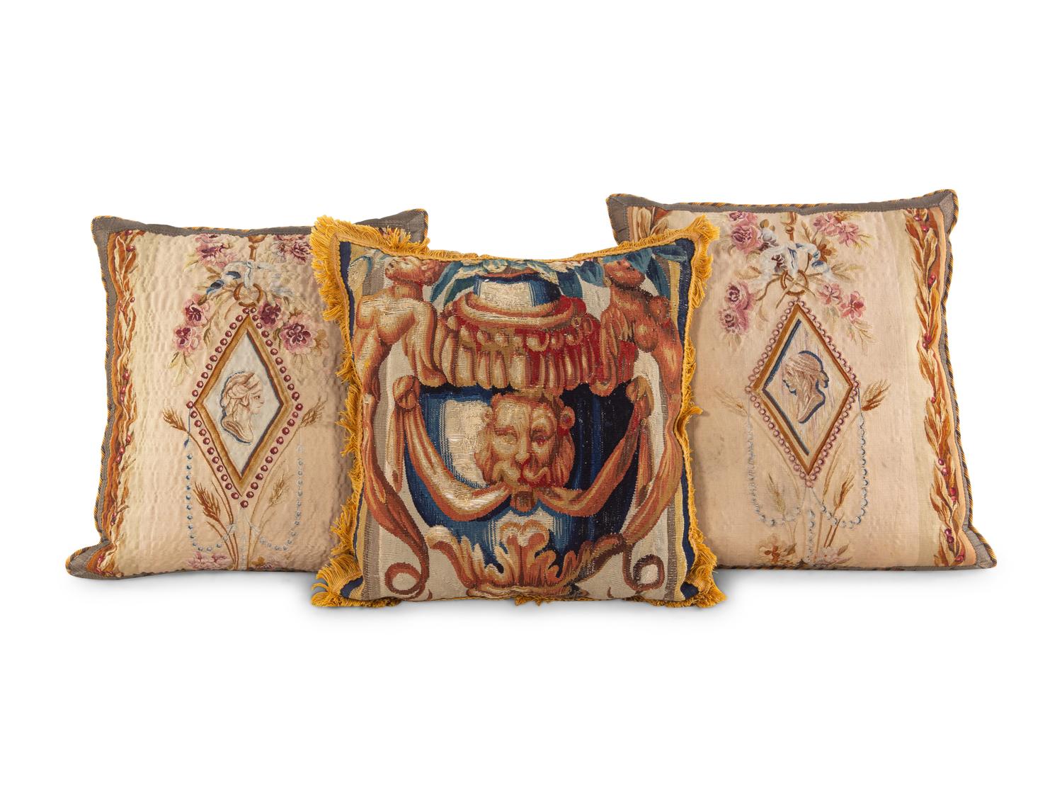 An English Tapestry and Needlework Cushion and Two Beauvais Tapestry Cushions