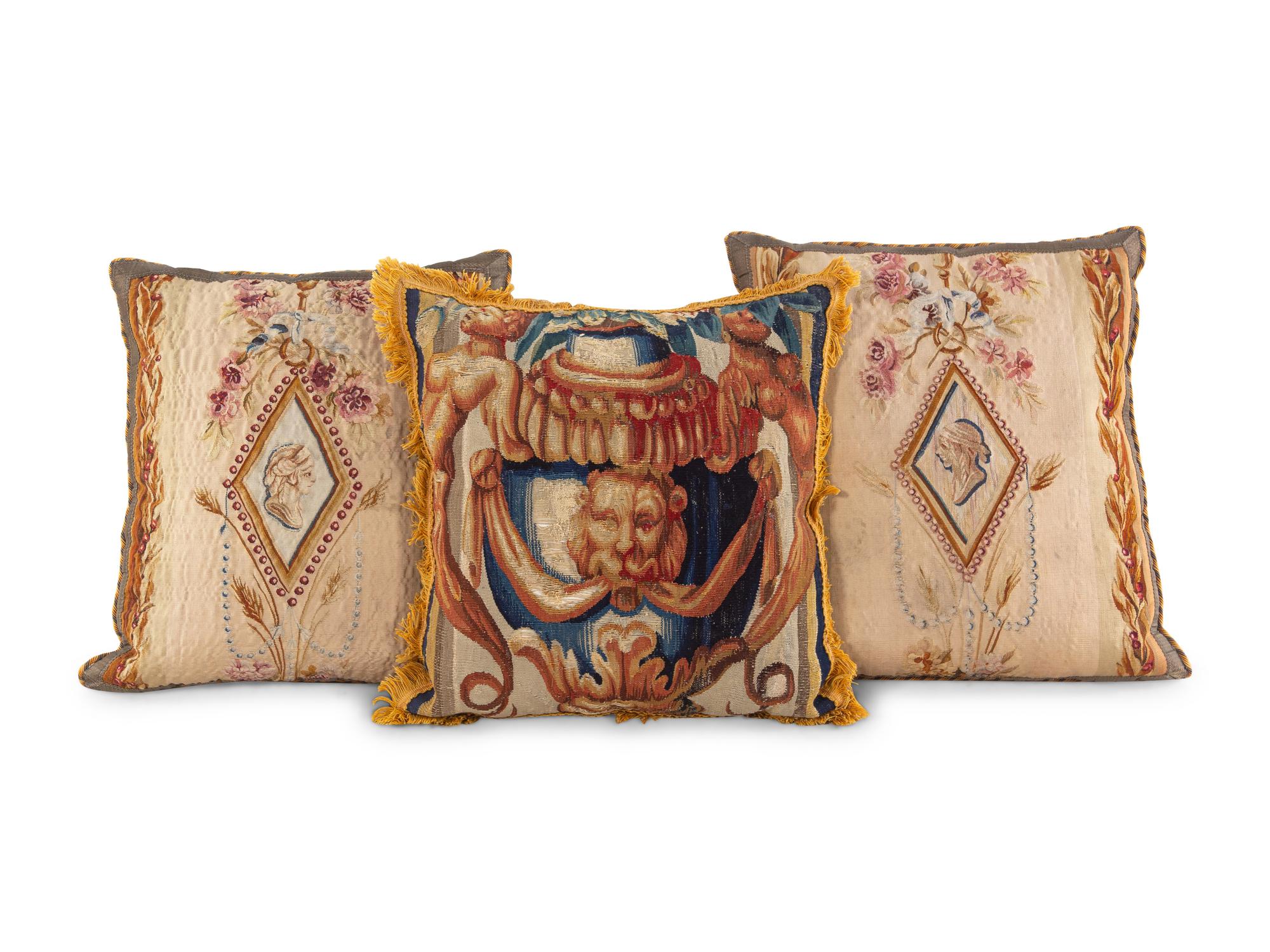 An English Tapestry and Needlework Cushion and Two Beauvais Tapestry Cushions