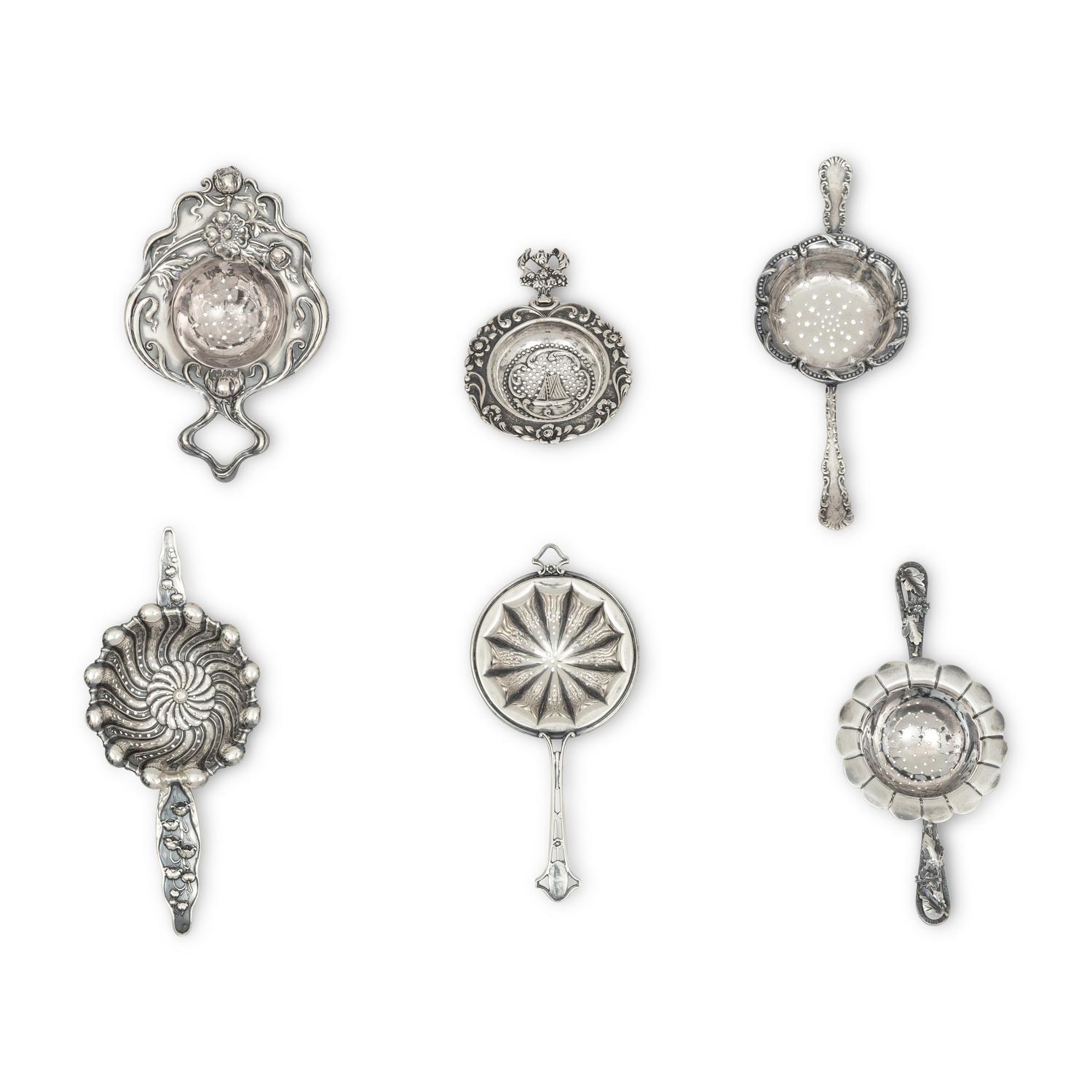 A Collection of Twenty Silver Tea Strainers