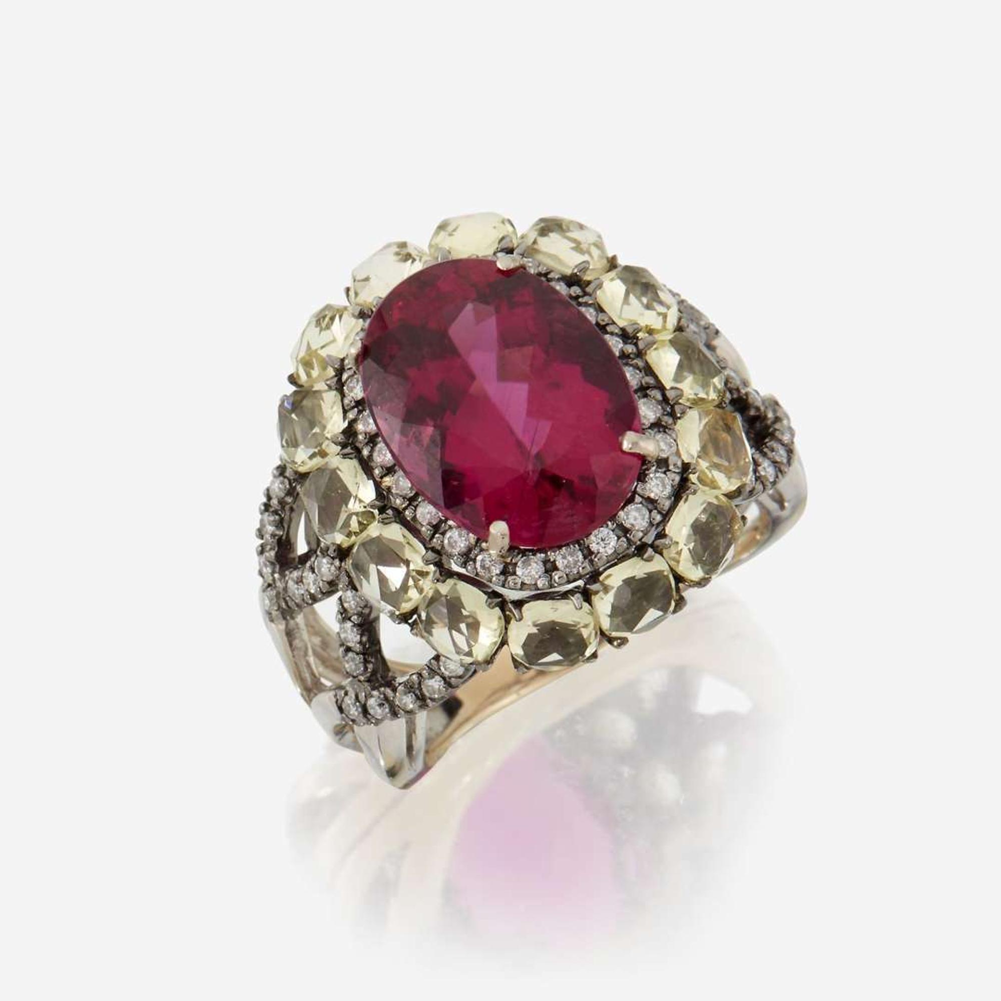 A pink tourmaline, peridot, diamond, and eighteen karat gold ring