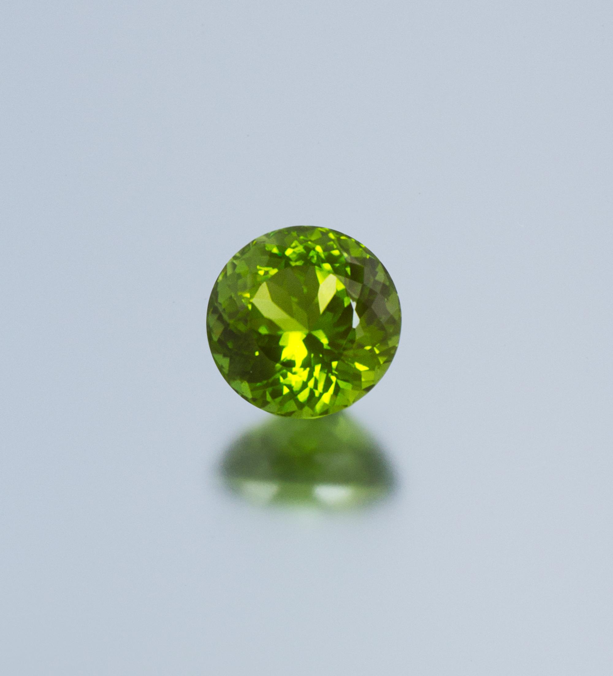 A 9.85 Carat Round Mixed Cut Peridot,