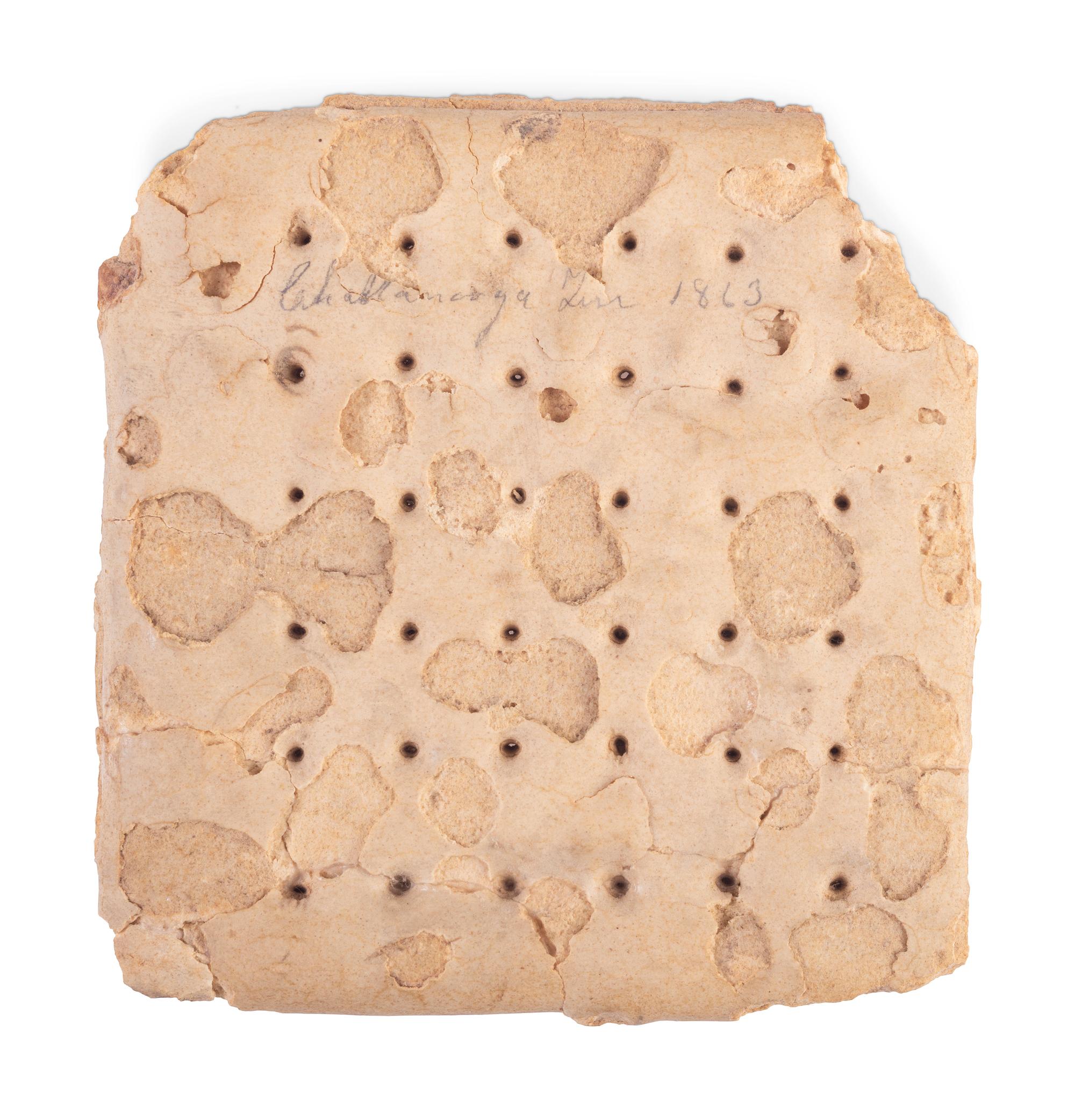 Civil War hardtack with penciled inscriptions identifying it to Corporal Wesley L. Jarvis of Co. K, 105th Ohio Volunteer Infantry.