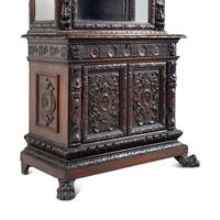 An Austrian Carved Walnut Cabinet