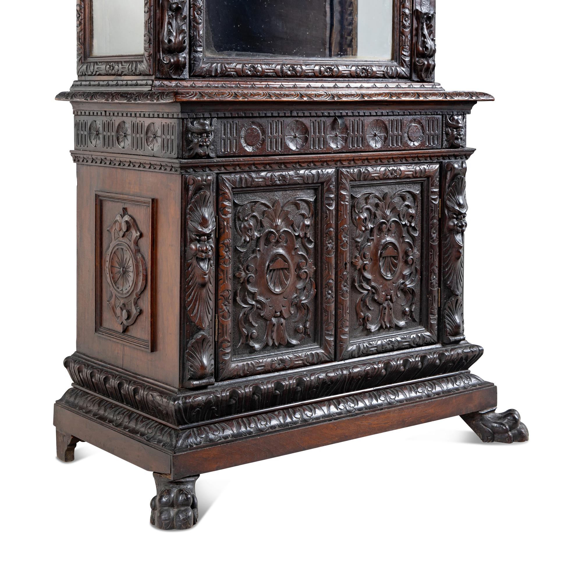 An Austrian Carved Walnut Cabinet