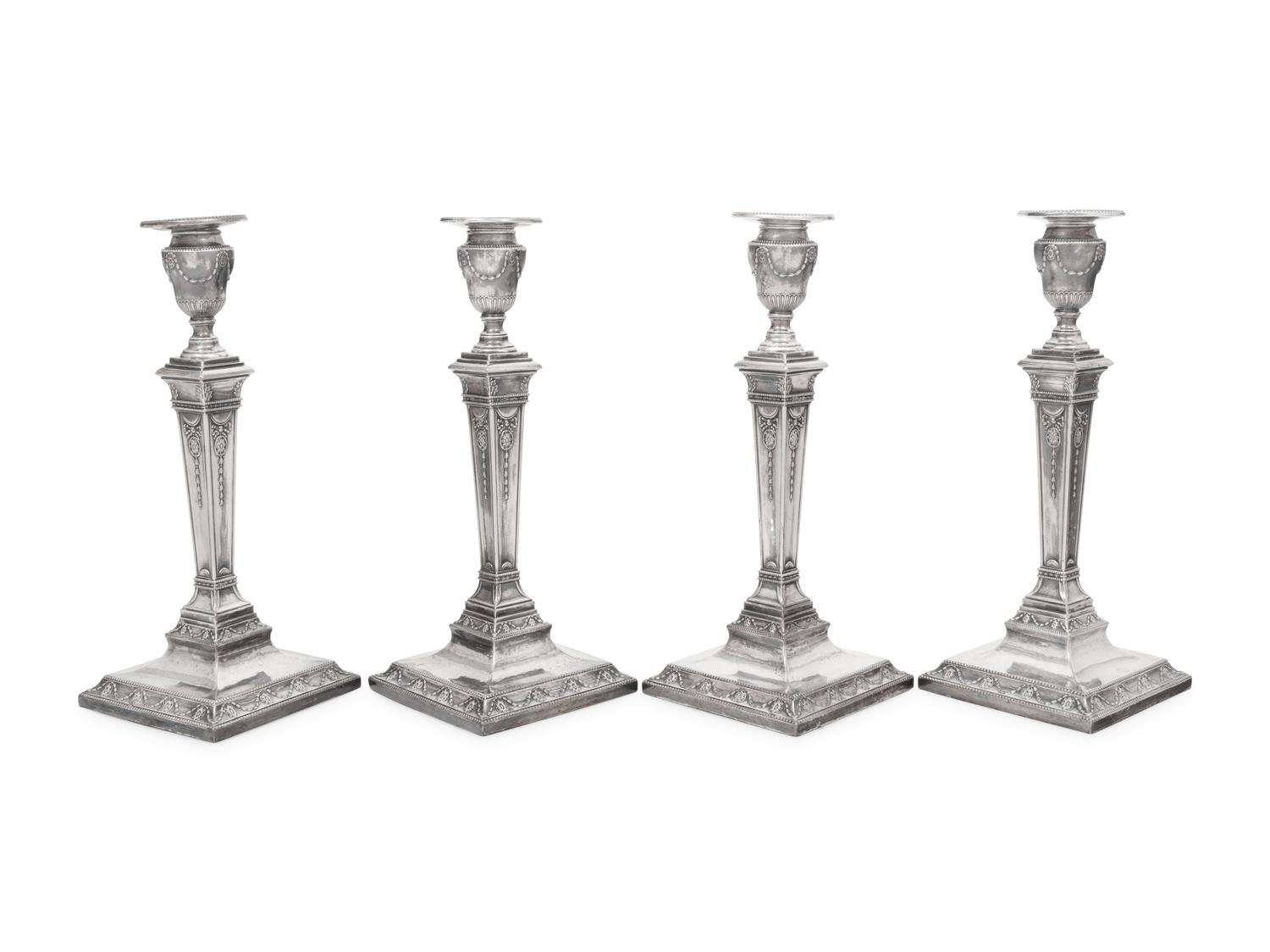 A Set of Four Silver-Plate Candlesticks