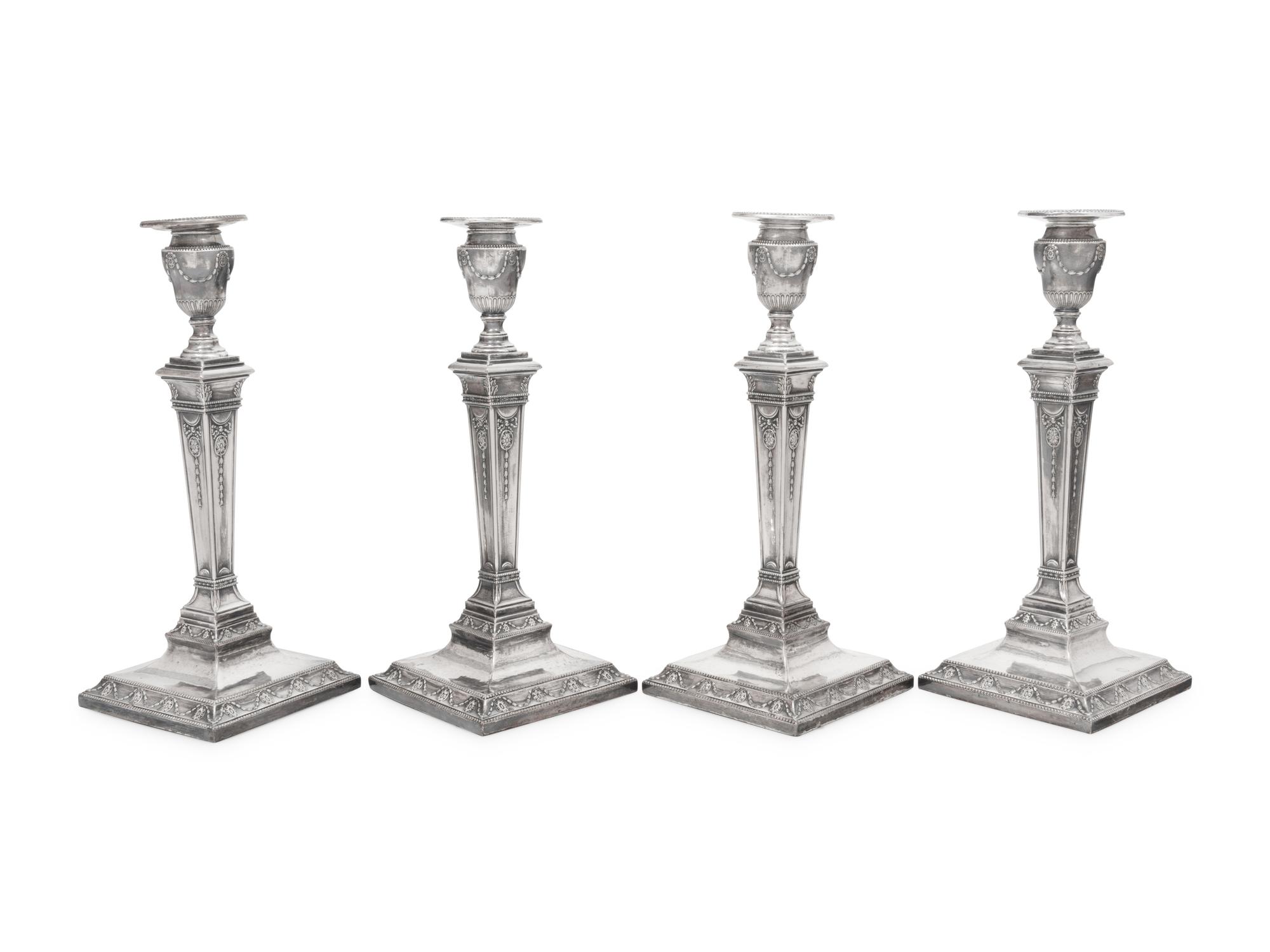 A Set of Four Silver-Plate Candlesticks