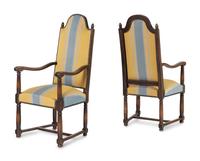 A Pair of French Provincial Carved Oak Fauteuils