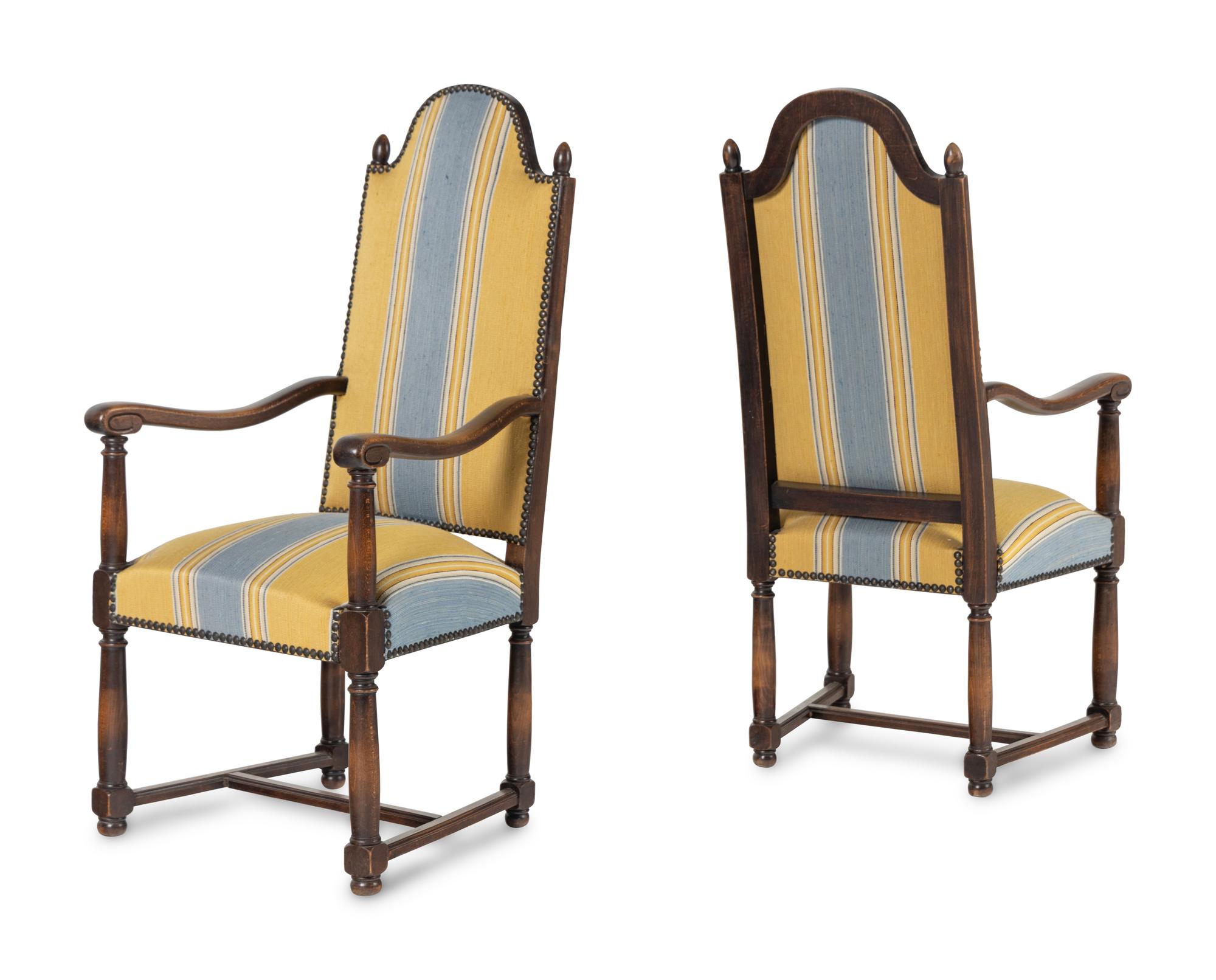A Pair of French Provincial Carved Oak Fauteuils