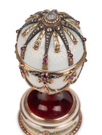 A 14 Karat Vari-Color Gold, Silver, Guilloché Enamel, Diamond, Pearl, and Cabochon Jewel-Mounted Surprise Egg