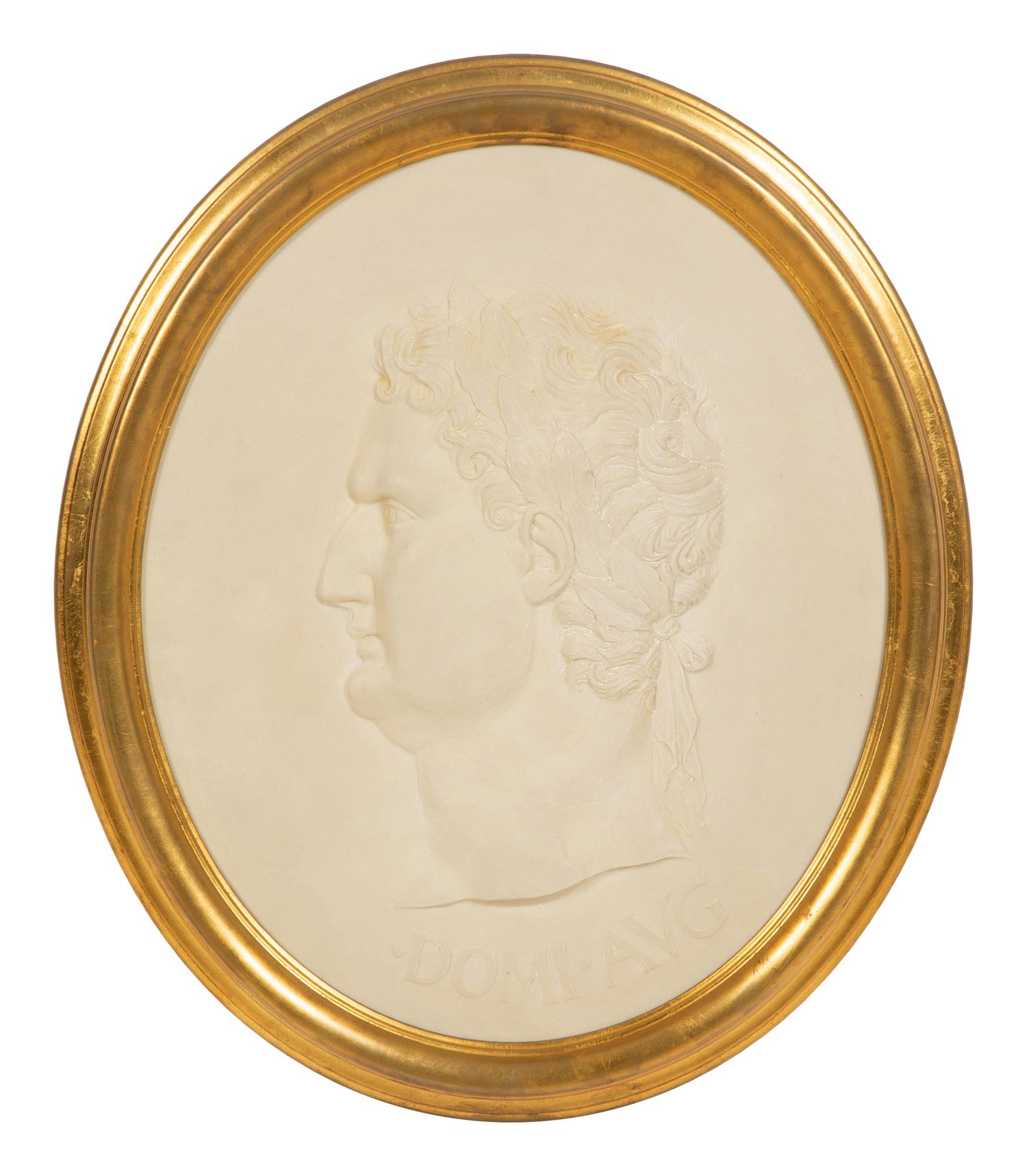 A Pair of Roman Style Composition Relief Plaques in Giltwood Frames