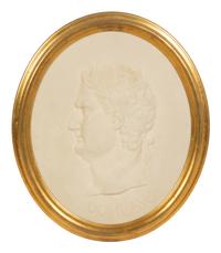 A Pair of Roman Style Composition Relief Plaques in Giltwood Frames