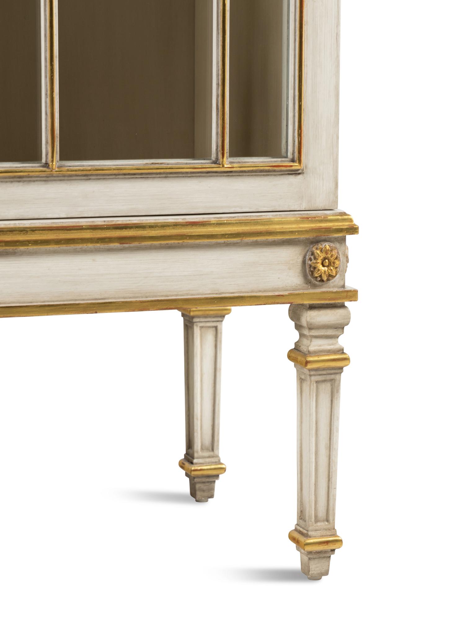 A Louis XVI Style Painted and Parcel Gilt Bookcase