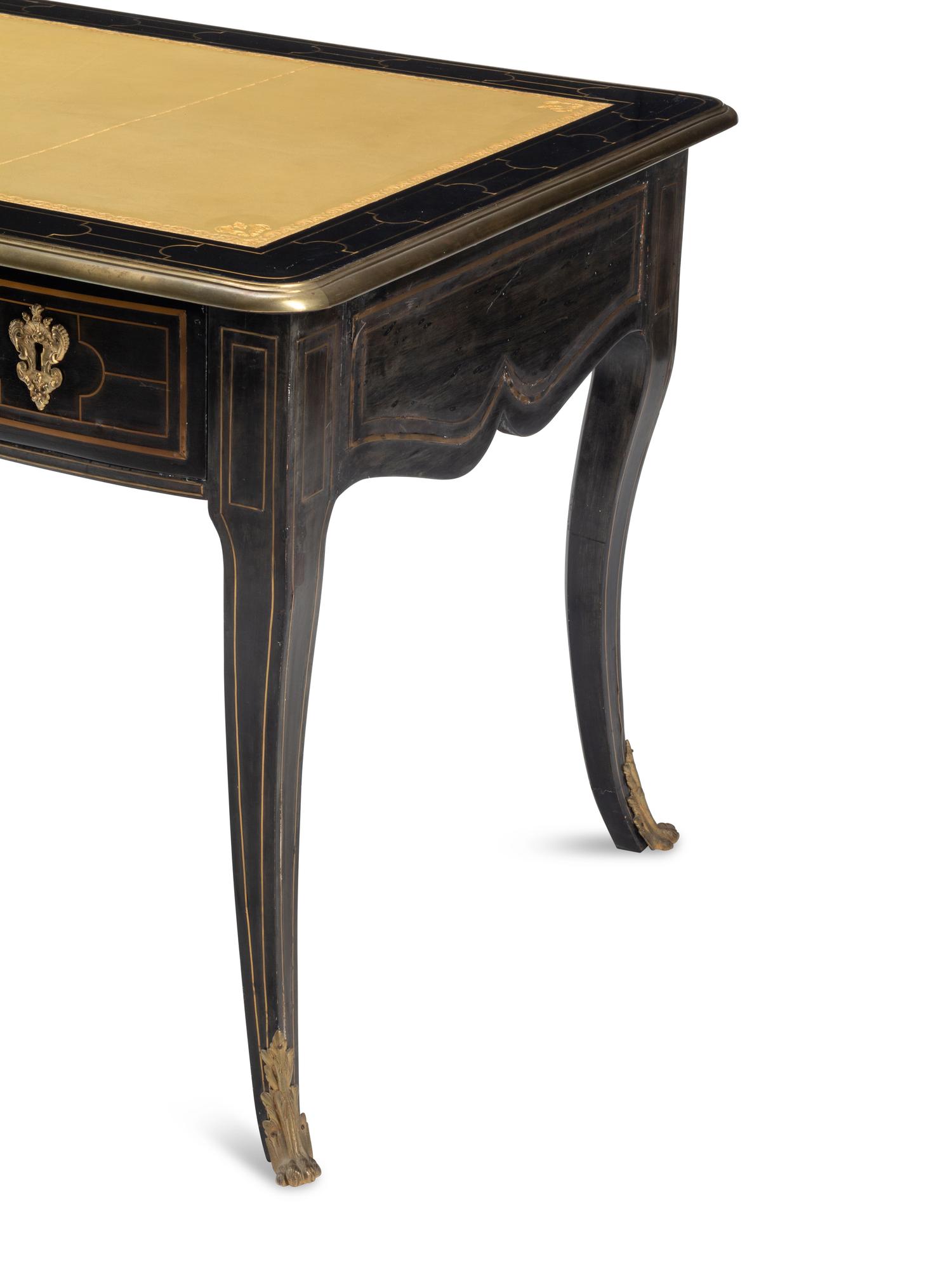 A Louis XIV Brass-Inlaid and Gilt Bronze Mounted Ebony Bureau Plat