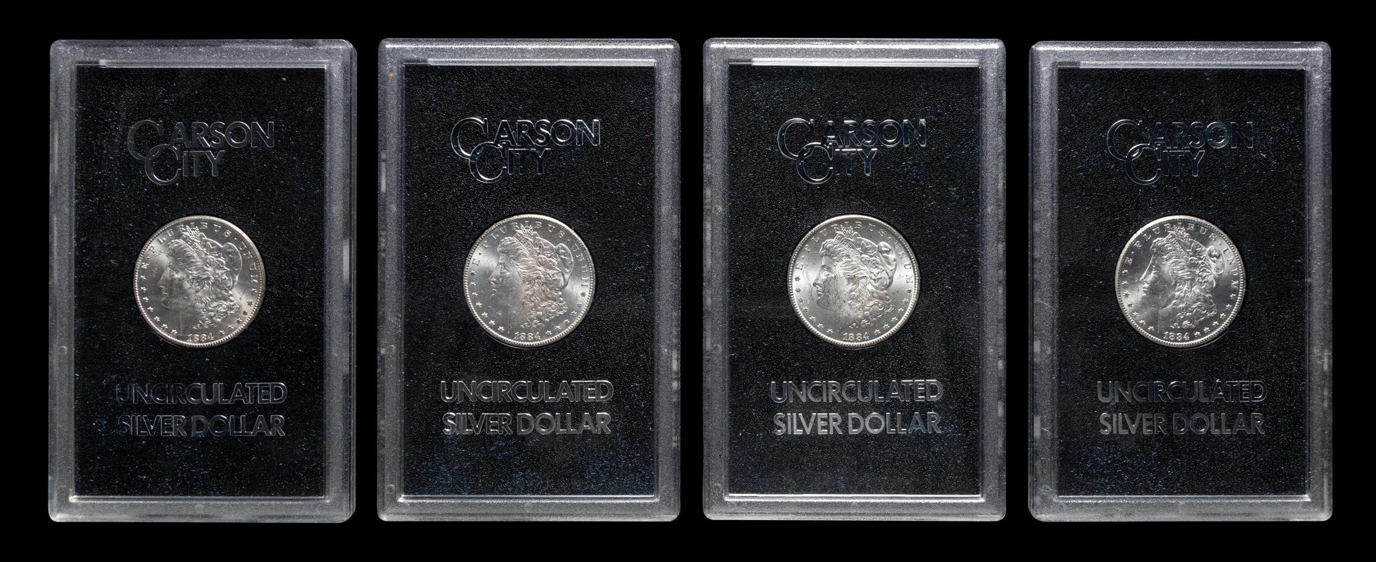 A Group of Eight 1884-CC GSA: Morgan $1 Coins