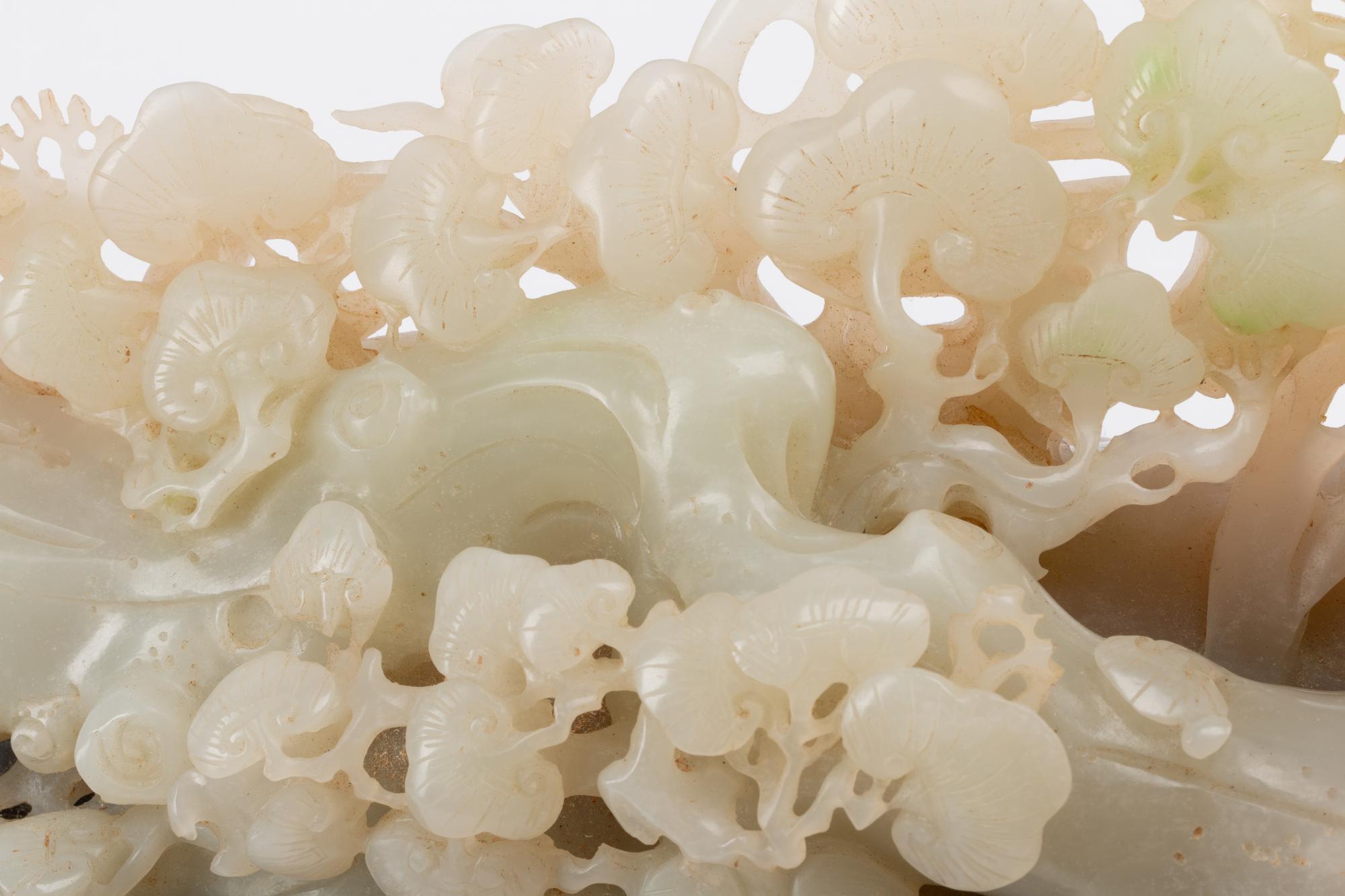 A Chinese Carved Hardstone Sculpture on a Wood Base
