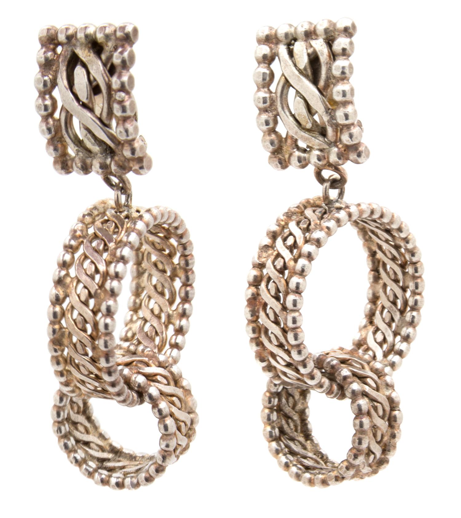 A Pair of Dominique Aurientis Silvertone Earclips, 3" x .75".