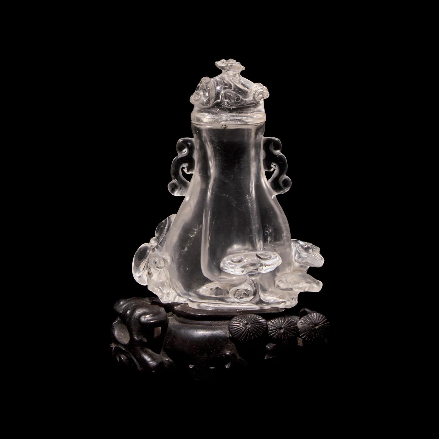 A Small Chinese Rock Crystal Vase and Cover with Wood Stand, Qing Dynasty 清 水晶靈芝紋小蓋瓶
