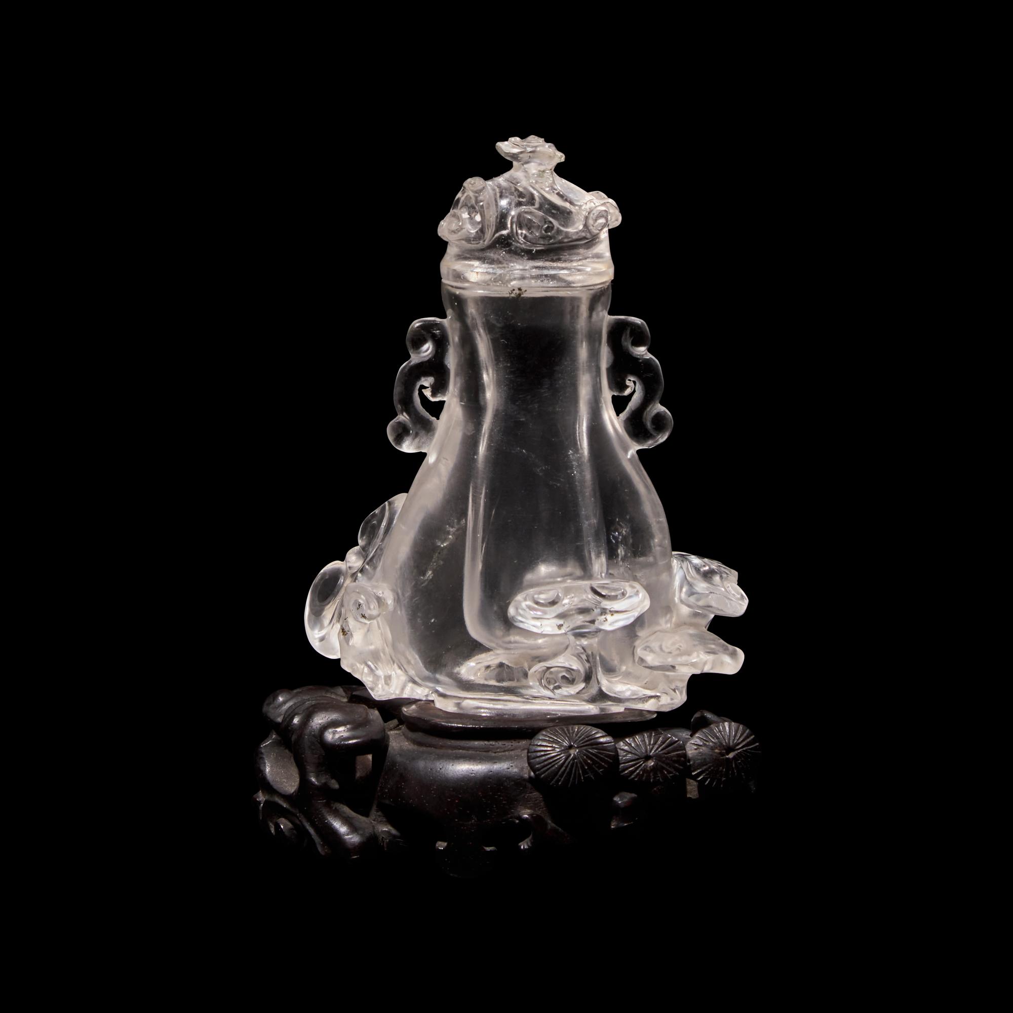 A Small Chinese Rock Crystal Vase and Cover with Wood Stand, Qing Dynasty 清 水晶靈芝紋小蓋瓶