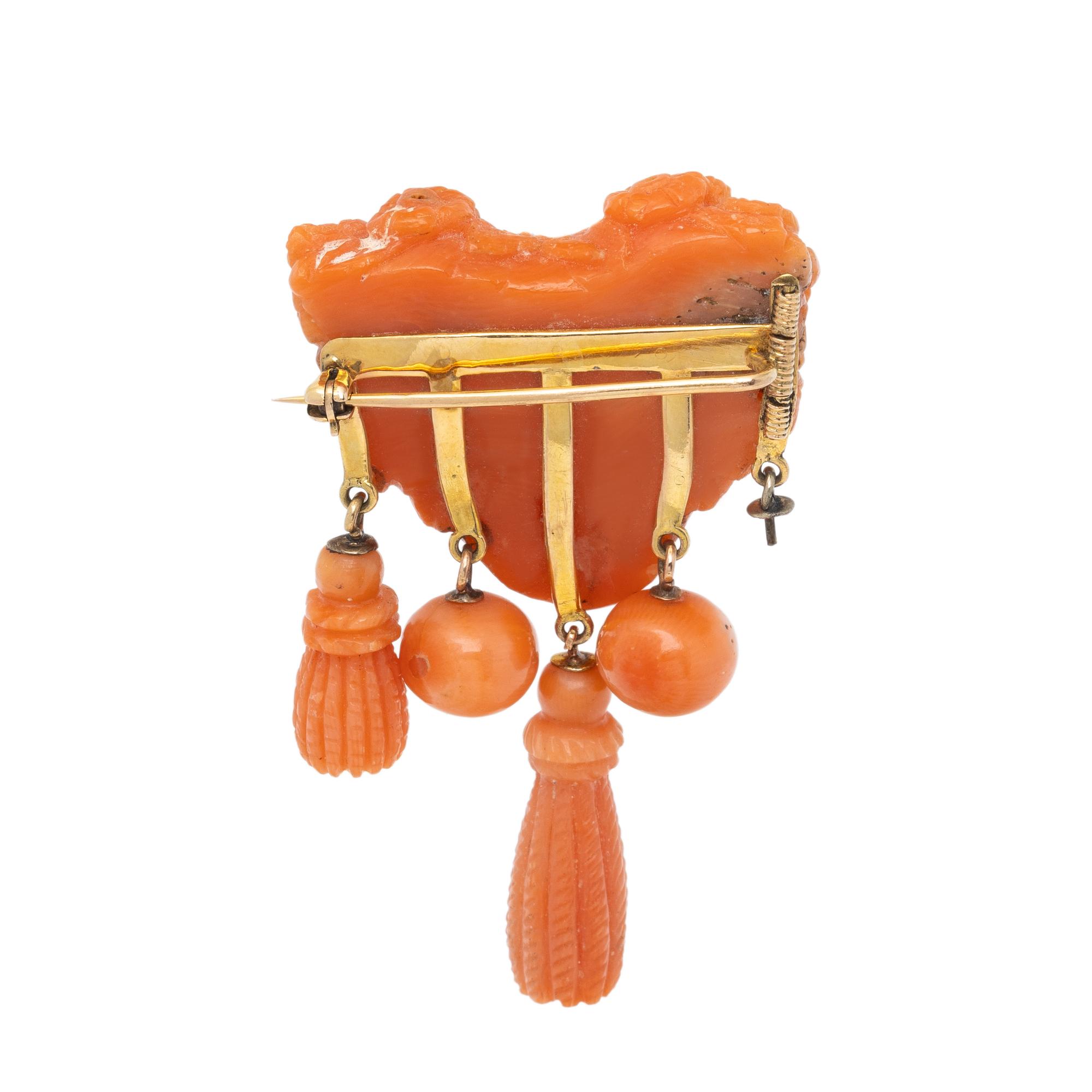 ANTIQUE, CARVED CORAL AND YELLOW GOLD BROOCH