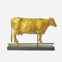 A patinated and gilded copper weathervane of a cow
