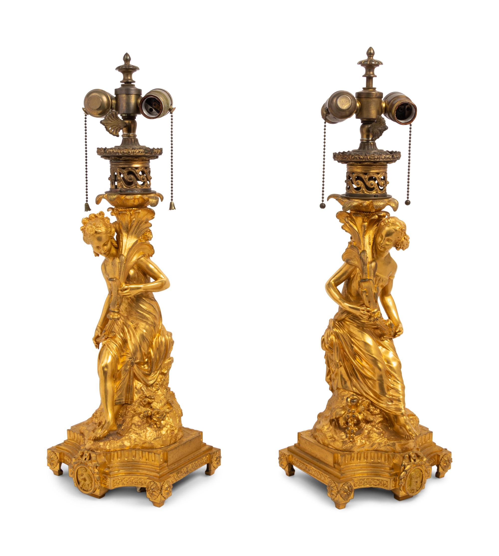 A Pair of French Gilt Bronze Figural Fluid Lamps Converted to Electricity