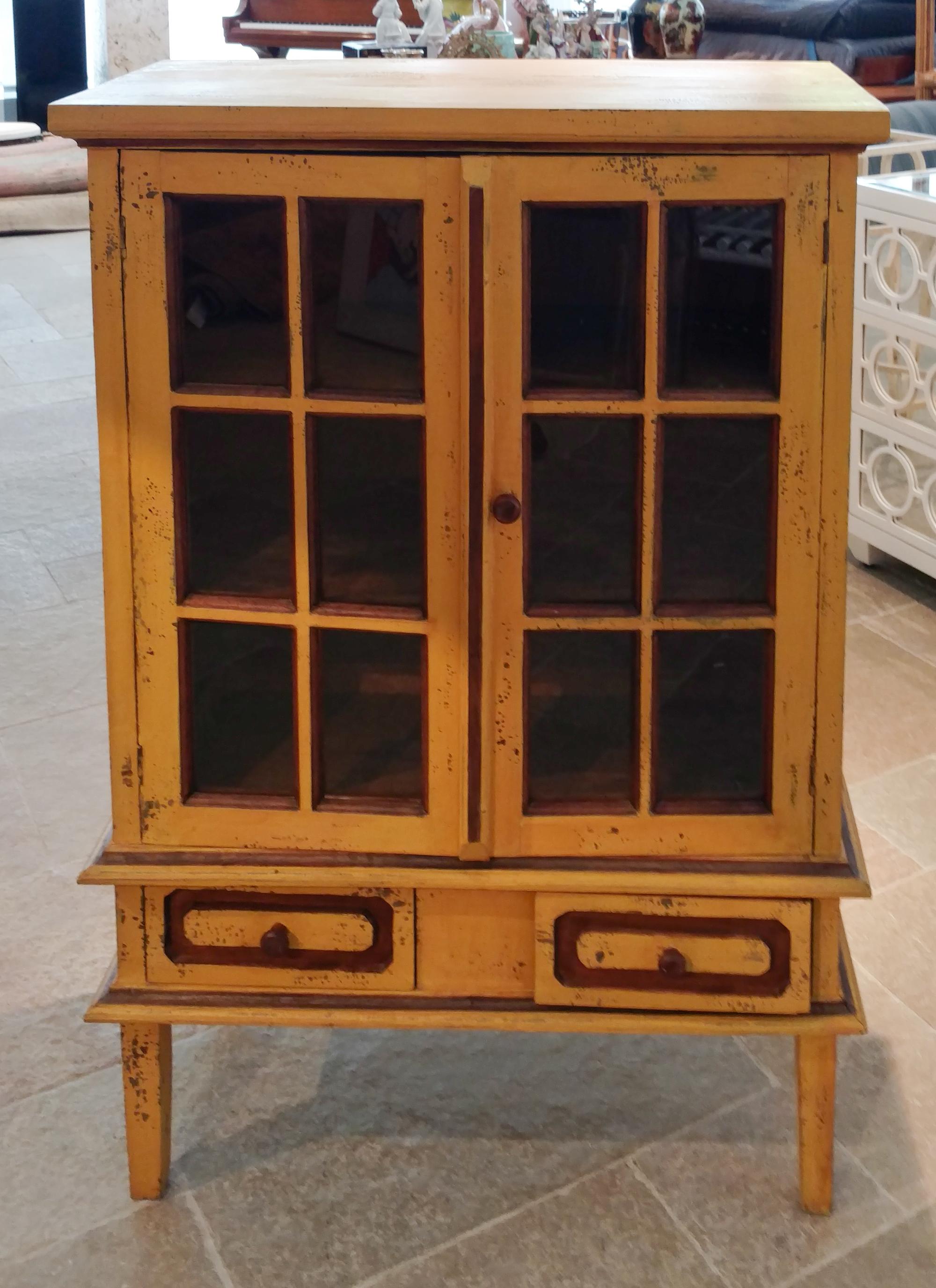 A Yellow Painted Two-Door Cabinet Height 43 1/2 inches.