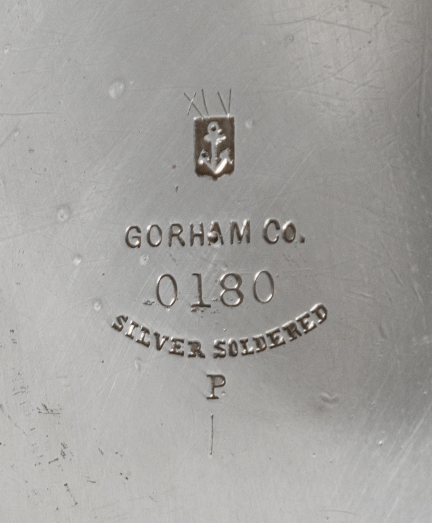 An American Silver Pitcher, Gorham Mfg. Co., Providence, RI, 1883, having a flattened spherical body with a cylindrical neck, the body