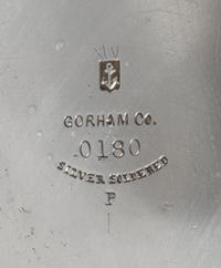 An American Silver Pitcher, Gorham Mfg. Co., Providence, RI, 1883, having a flattened spherical body with a cylindrical neck, the body
