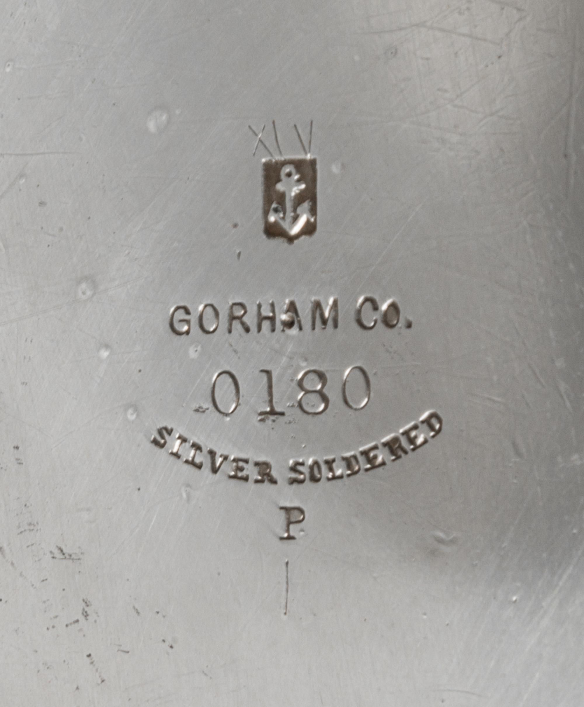 An American Silver Pitcher, Gorham Mfg. Co., Providence, RI, 1883, having a flattened spherical body with a cylindrical neck, the body