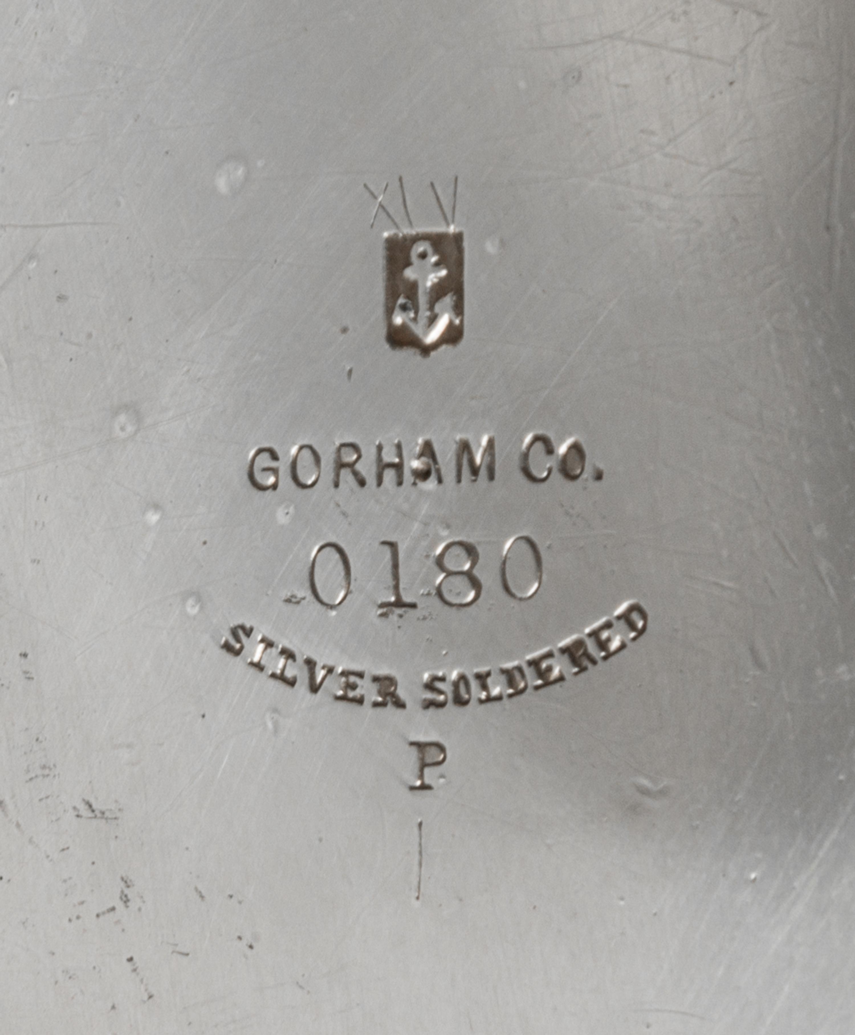 An American Silver Pitcher, Gorham Mfg. Co., Providence, RI, 1883, having a flattened spherical body with a cylindrical neck, the body